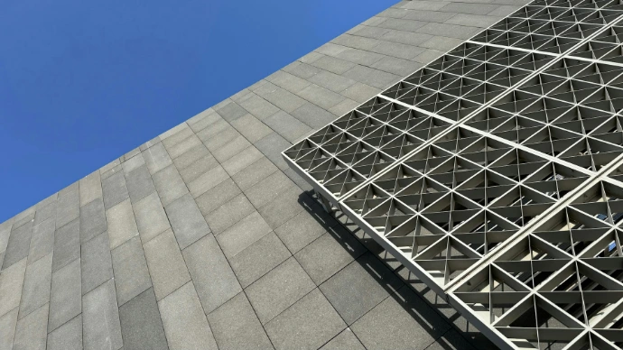 a very tall building with a sky in the background